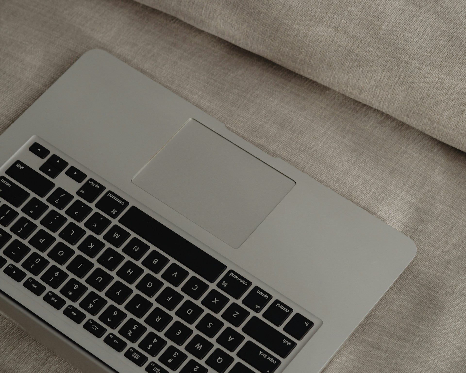 Laptop on Sofa for Beautiful websites that don't convert by Amber Seagraves