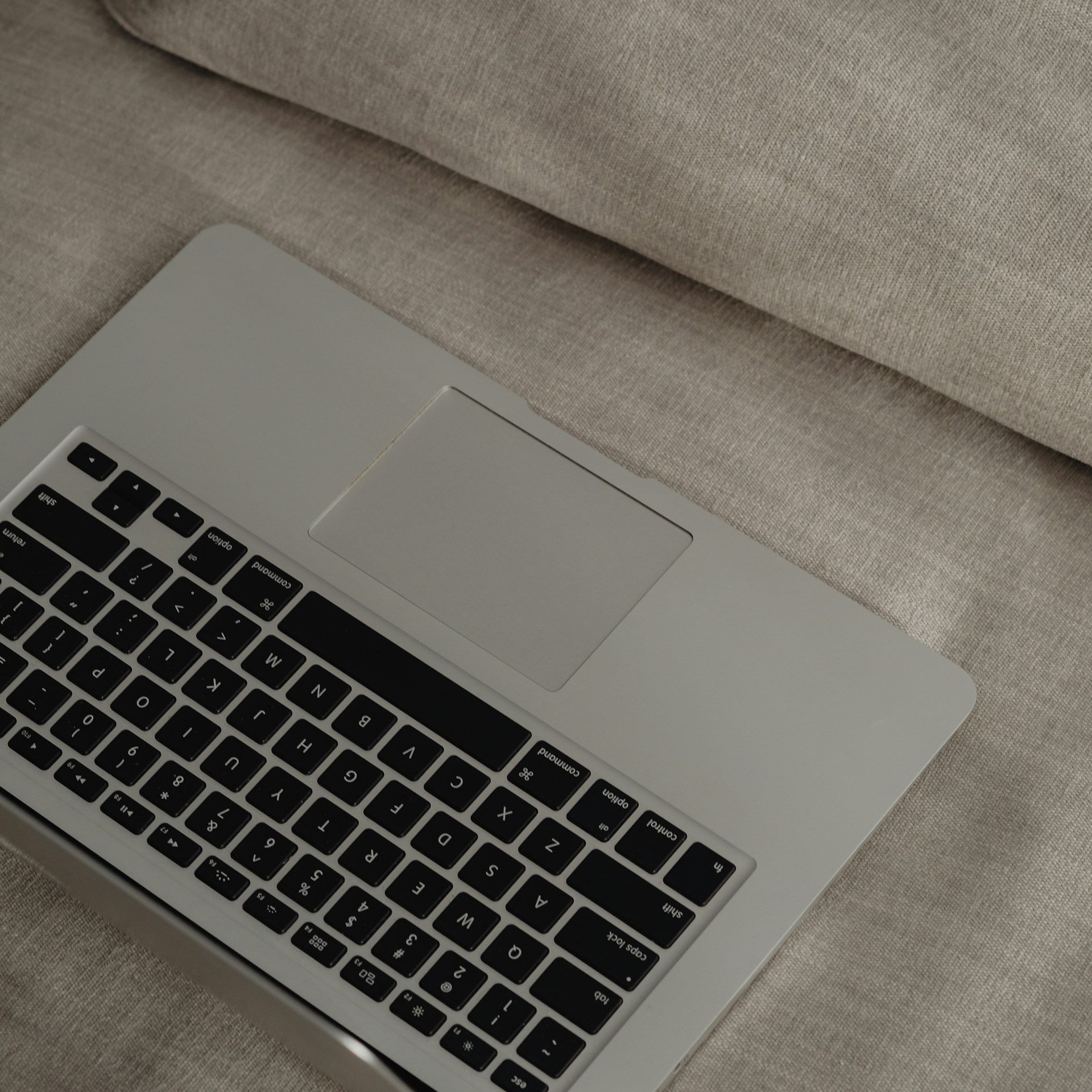 Laptop on Sofa for Beautiful websites that don't convert by Amber Seagraves