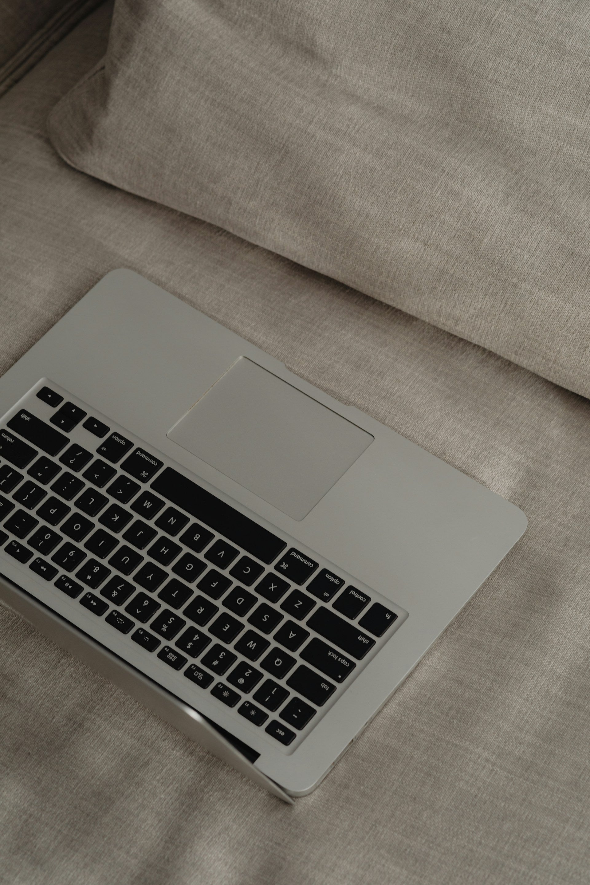 Laptop on Sofa for Beautiful websites that don't convert by Amber Seagraves