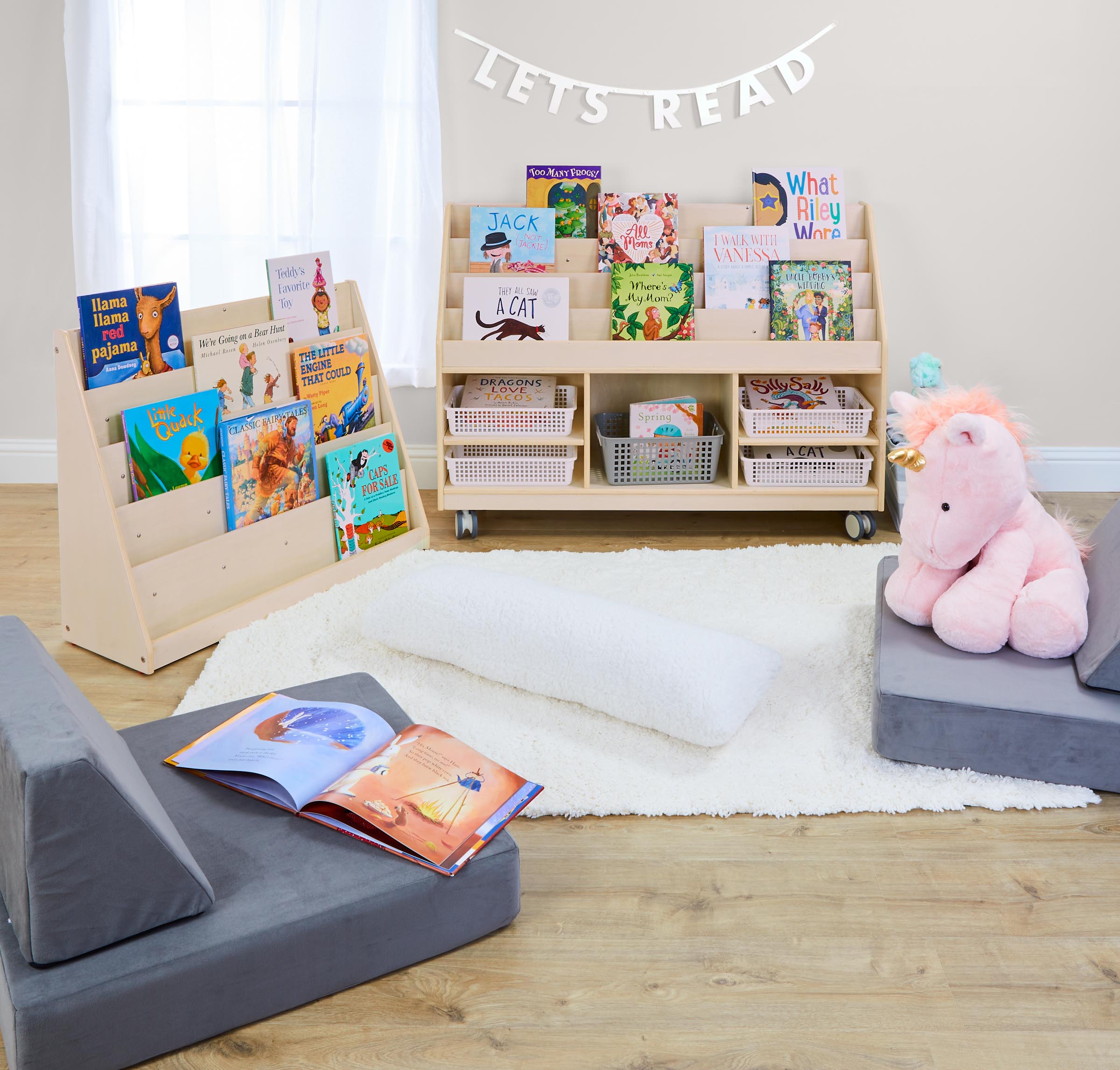 Children's Factory Wooden Bookshelves with books, unicorns and seating.