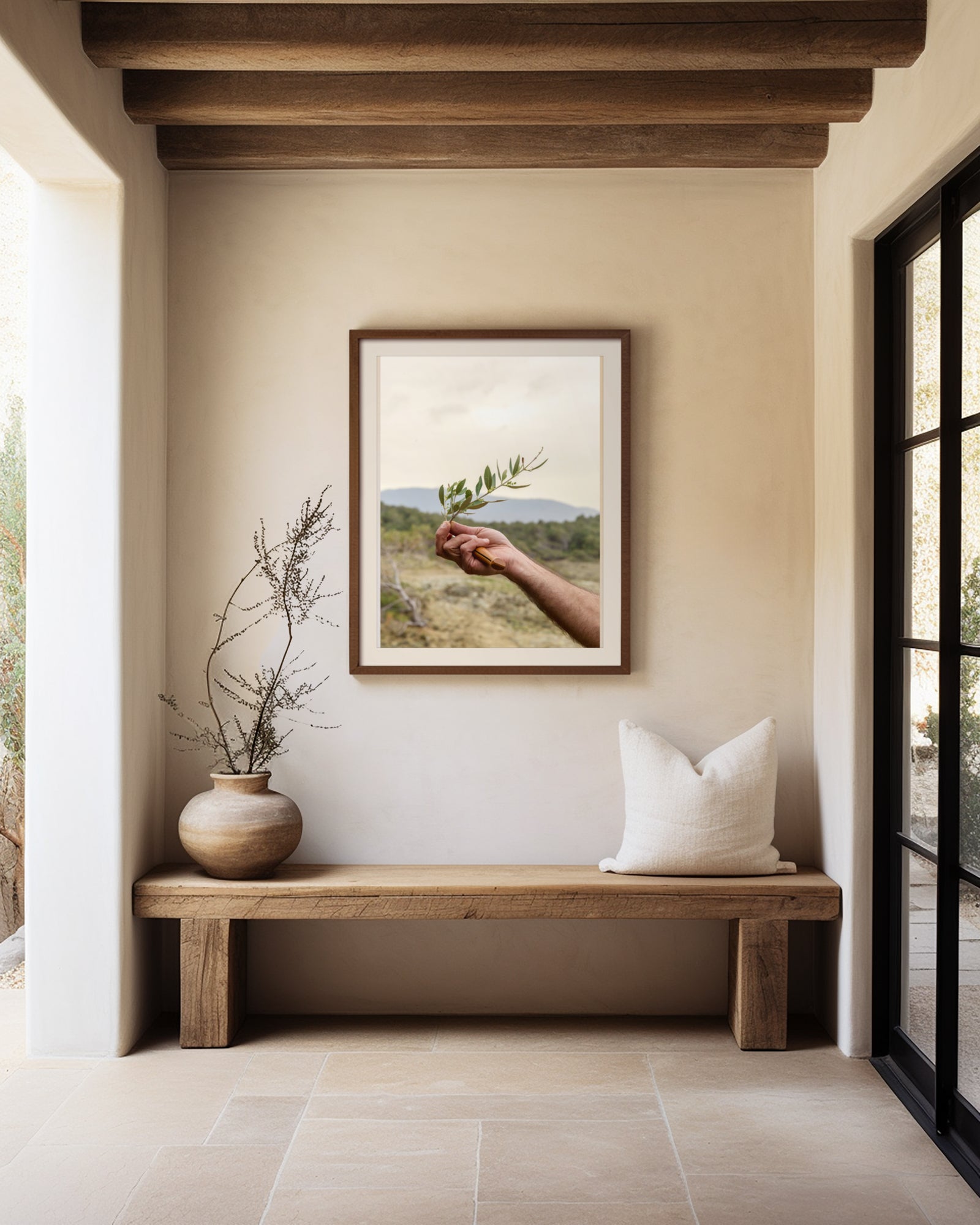 Neutral Hallway with large window wood beams rustic bench with artwork of hand