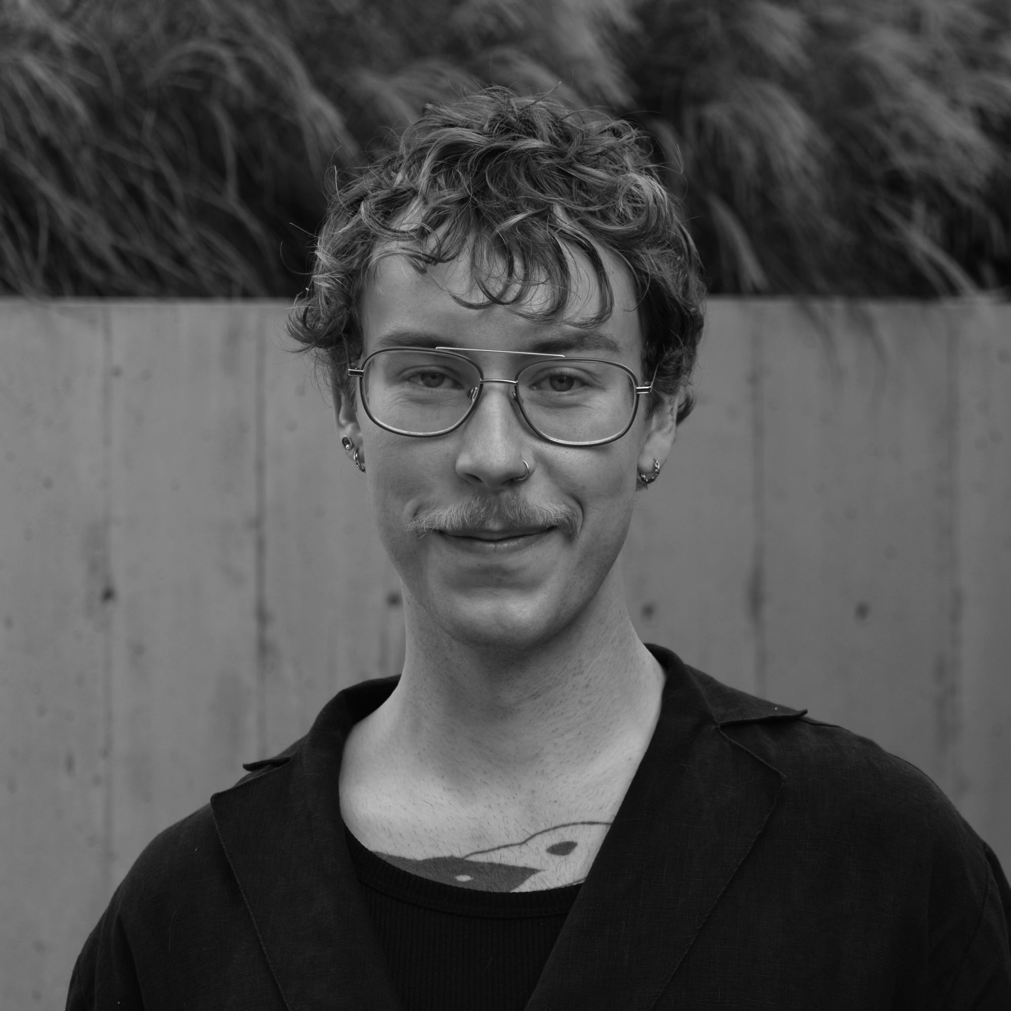 Black and white portrait of man with blonde short hair and glasses.  Lueking Brand Relations and Creative Projects for Studio Seagraves Profile Pic